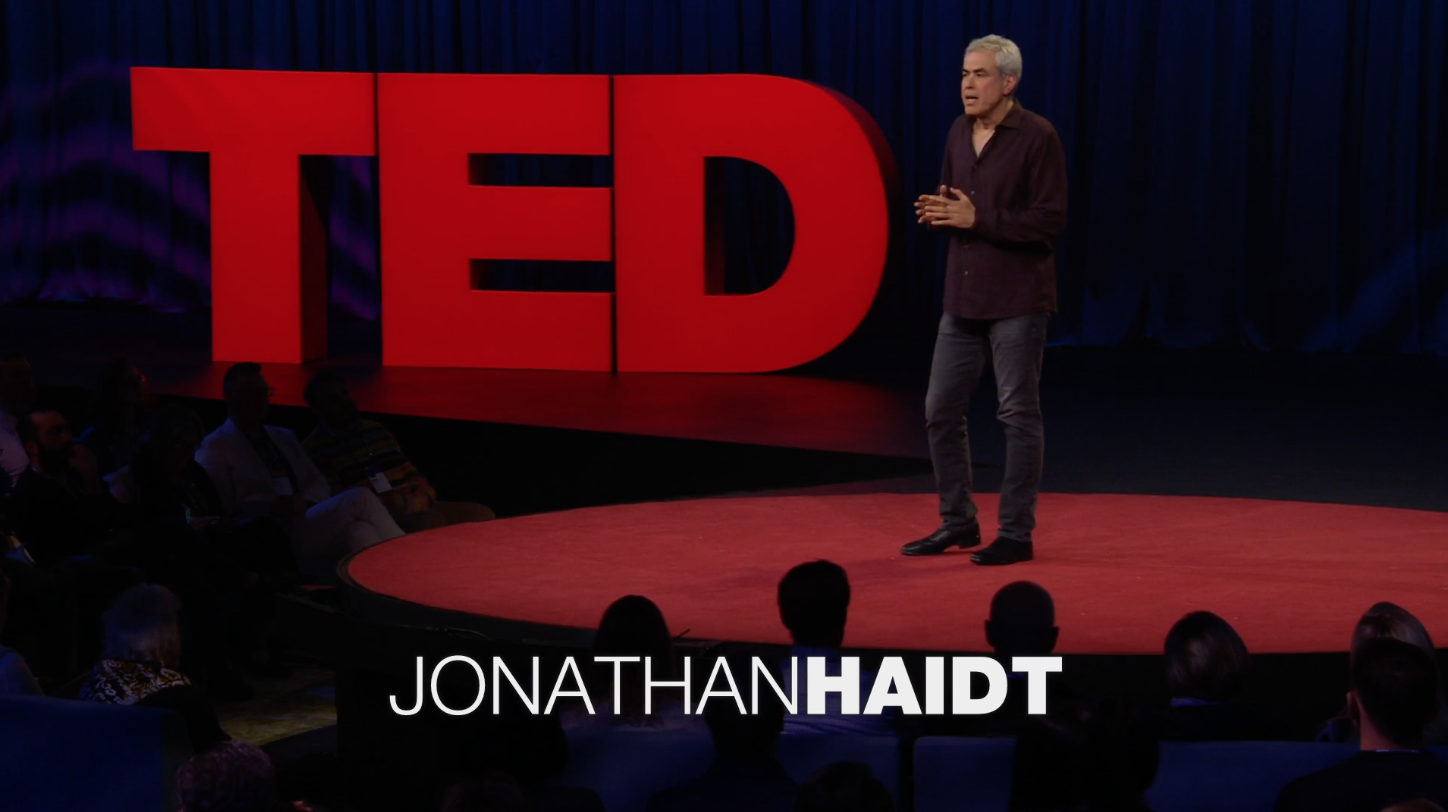 Jonathan on stage TED TALK